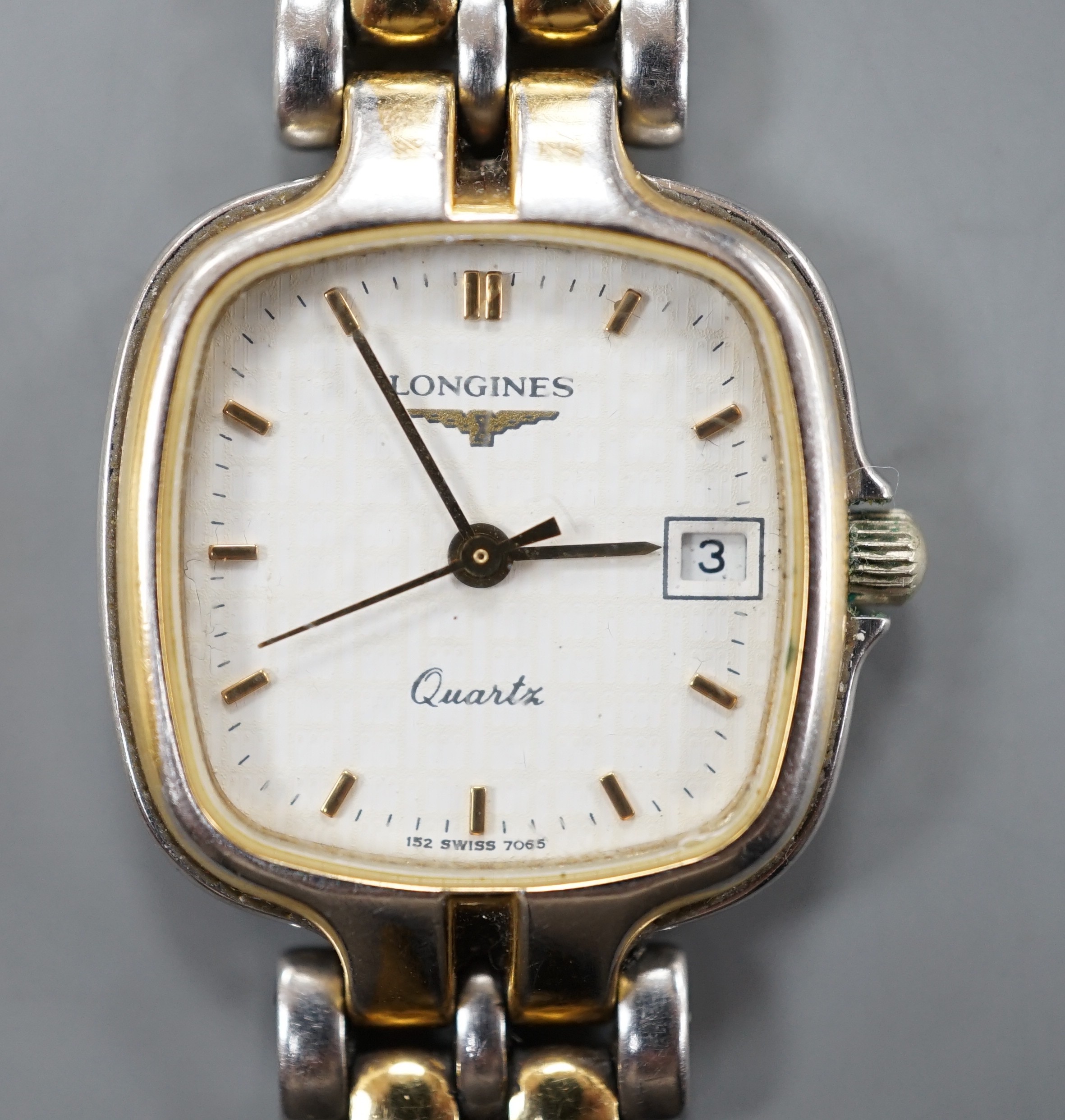 A lady's modern steel and gold plated Longines quartz wrist watch, on a steel and gold plated Longines bracelet.